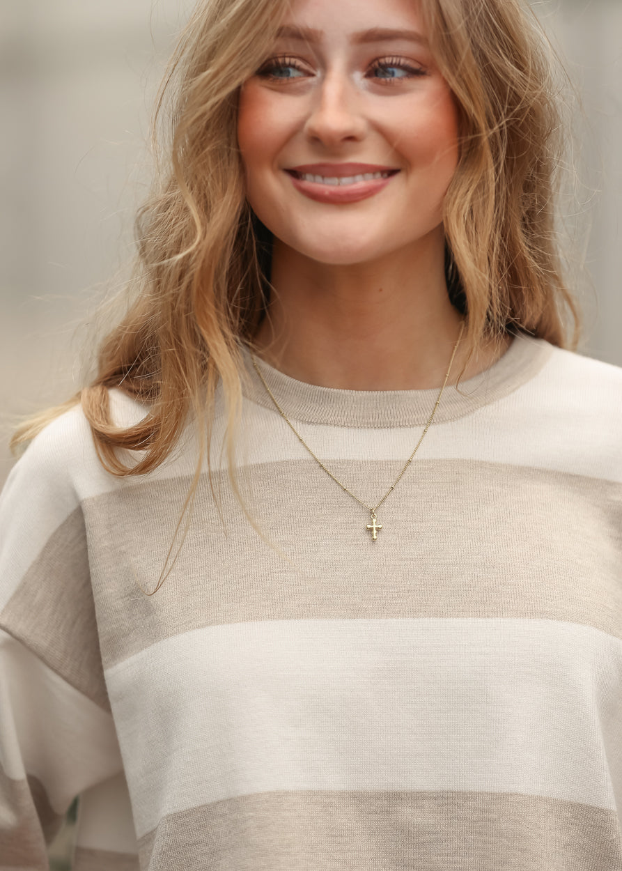 Close up of relaxed fit striped t-shirt in ivory and taupe