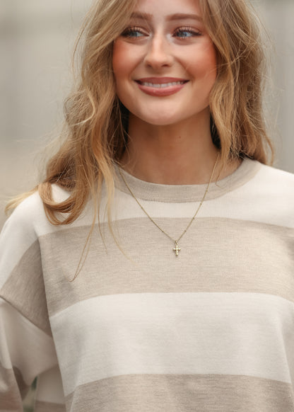 Close up of relaxed fit striped t-shirt in ivory and taupe