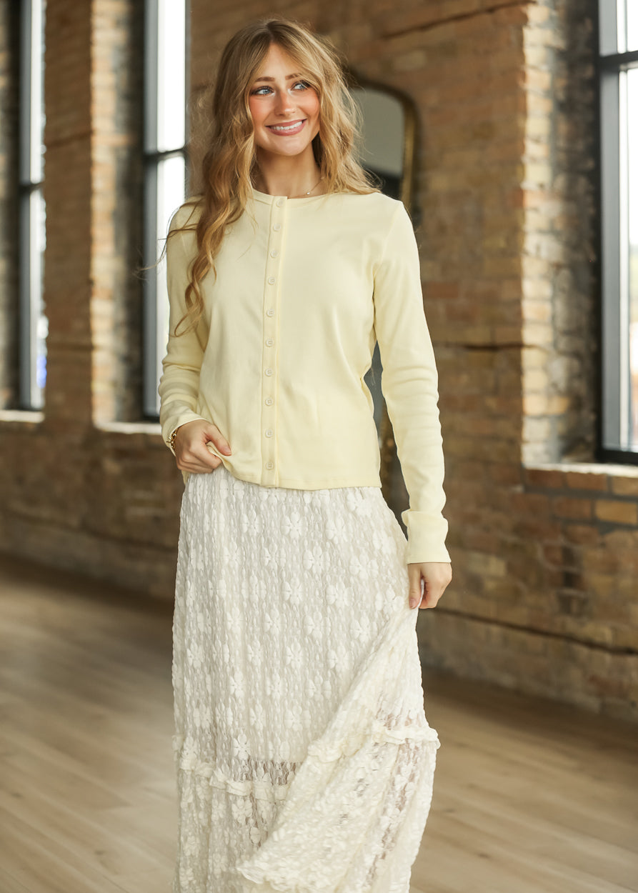 Butter ribbed long sleeve knit top paired with a flowing ivory floral lace skirt.