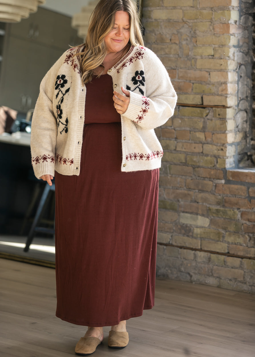 Romy mulberry dress layered with a cream floral button cardigan and styled with tan mules.