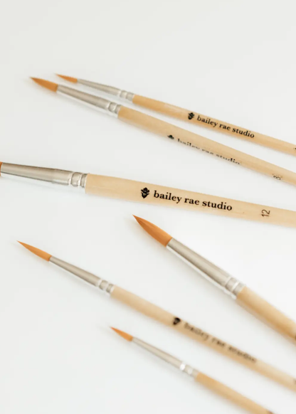 Set of brushes with 'bailey rae studio' branding on a white background