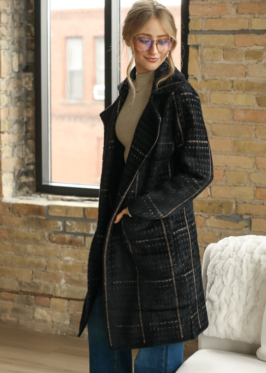 Sadie & Sage Marceau black houndstooth coat showing the oversized open-front fit and lapel collar.