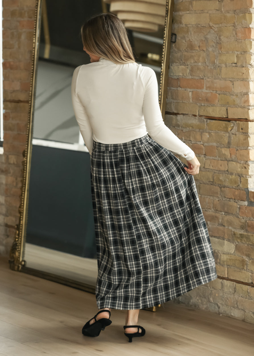 Black plaid A-line midi skirt with elastic waistband and button-front detail.