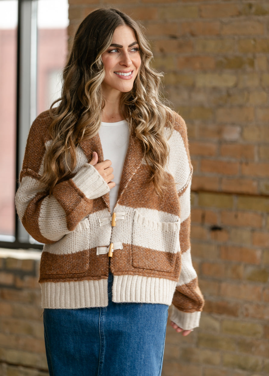 Chestnut striped Cain sweater styled over a cream tee and denim maxi skirt.