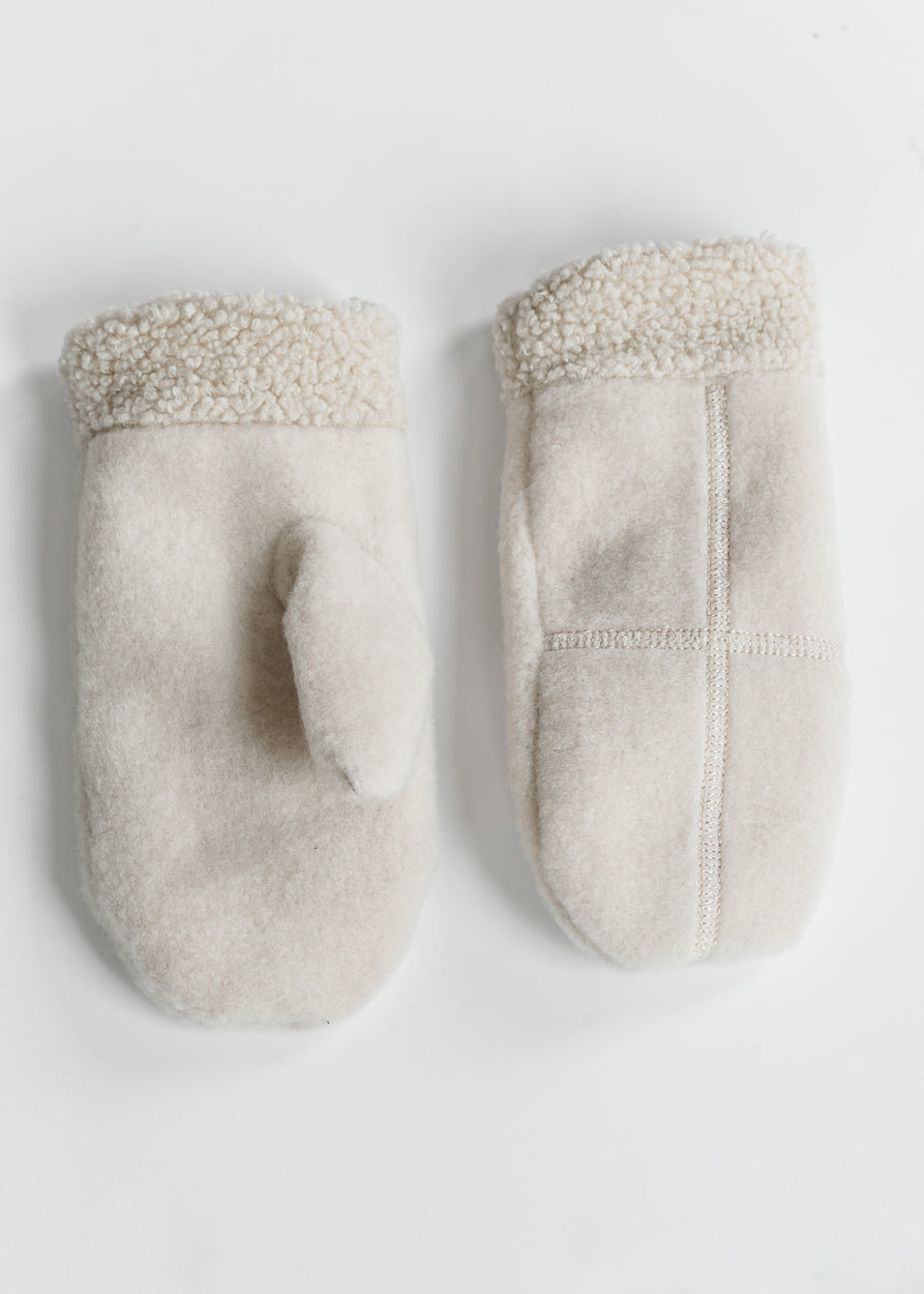 Soft ivory mittens with plush cuffs styled with a taupe beanie and winter outerwear.