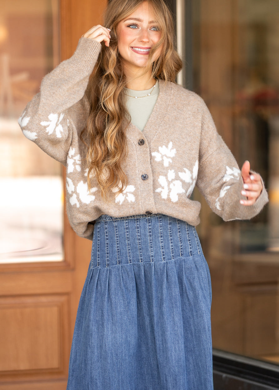 Oatmeal floral jacquard cardigan with button front and oversized fit, styled over a neutral layering top.