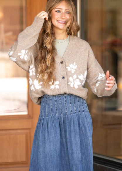 Oatmeal floral jacquard cardigan with button front and oversized fit, styled over a neutral layering top.