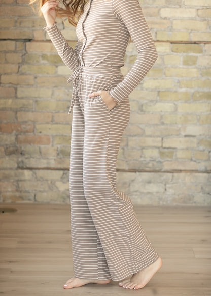 Side view of taupe striped lounge set with wide leg pants.
