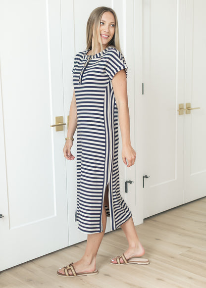 Navy and ivory striped midi dress styled with flat sandals