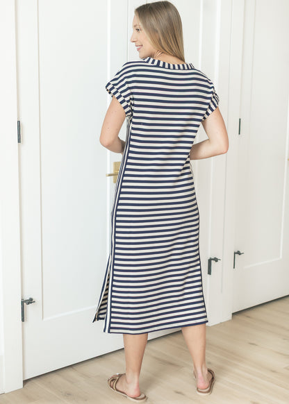Back view of striped knit midi dress with relaxed silhouette
