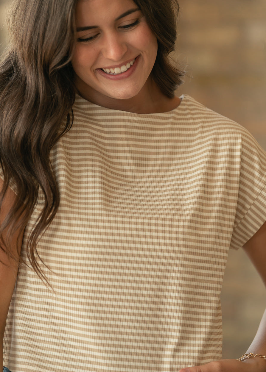 Close-up of taupe and cream striped rib knit top showing the wide neckline and cuffed short sleeve.