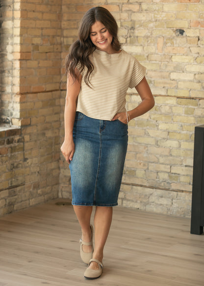 Taupe stripe rib knit boxy top styled with a dark wash denim midi skirt and neutral flats.