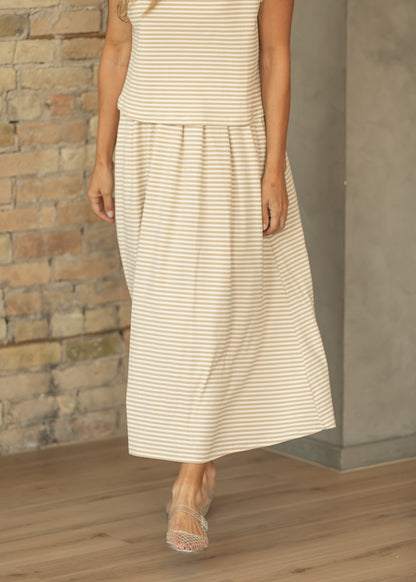 Front view of taupe stripe rib knit midi skirt showing the gathered waist and softly flowing shape.