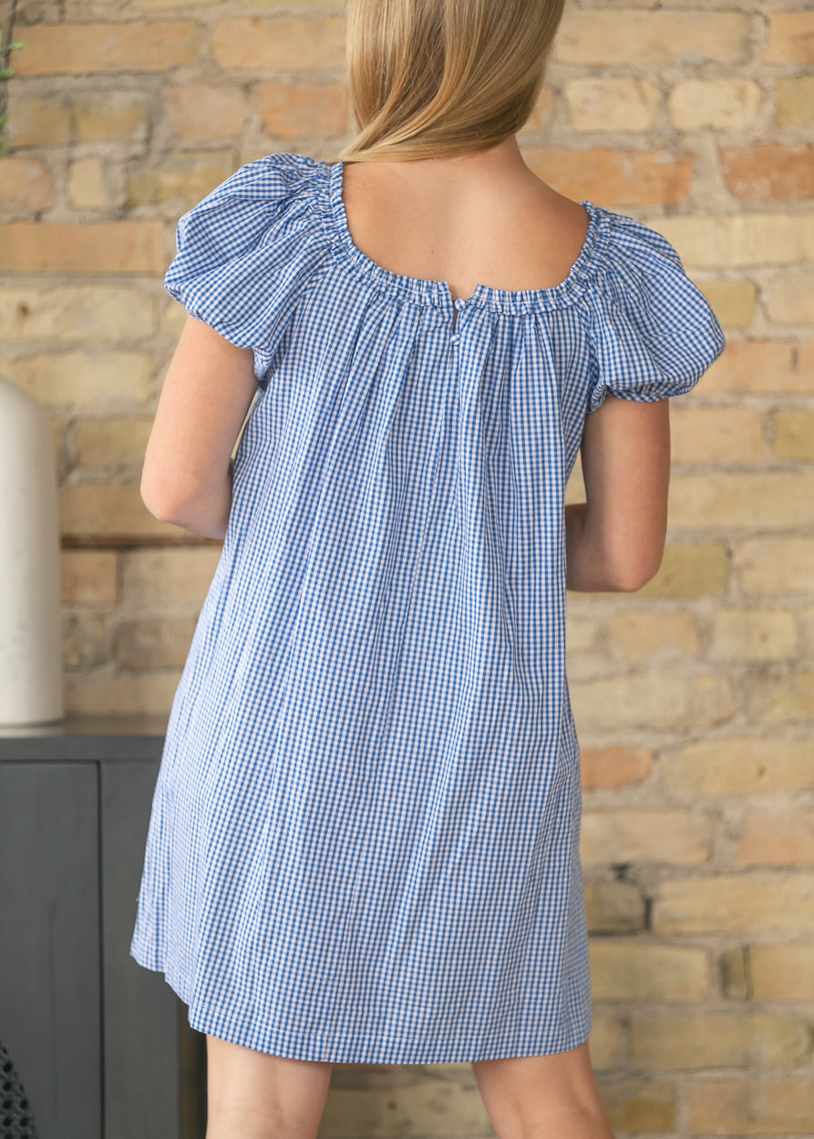Back view of blue gingham cotton midi dress with gathered neckline