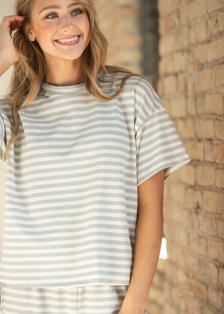 Light blue and cream striped short sleeve tee with crew neckline and relaxed boxy fit.