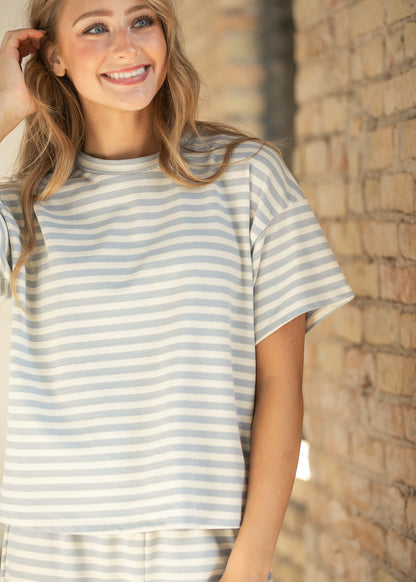Light blue and cream striped short sleeve tee with crew neckline and relaxed boxy fit.