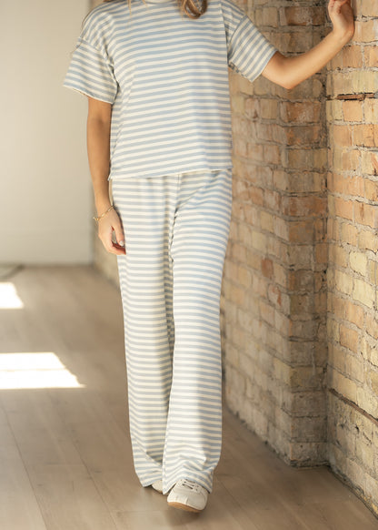 Close-up of the ivory and pale blue striped Bailey pant with an elastic waistband.
