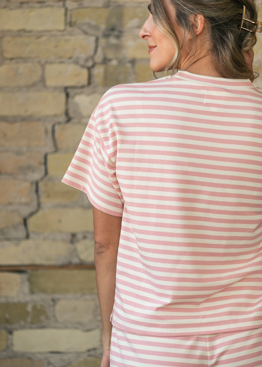 Back detail of pink and cream striped tee showing relaxed shoulders and short sleeves.