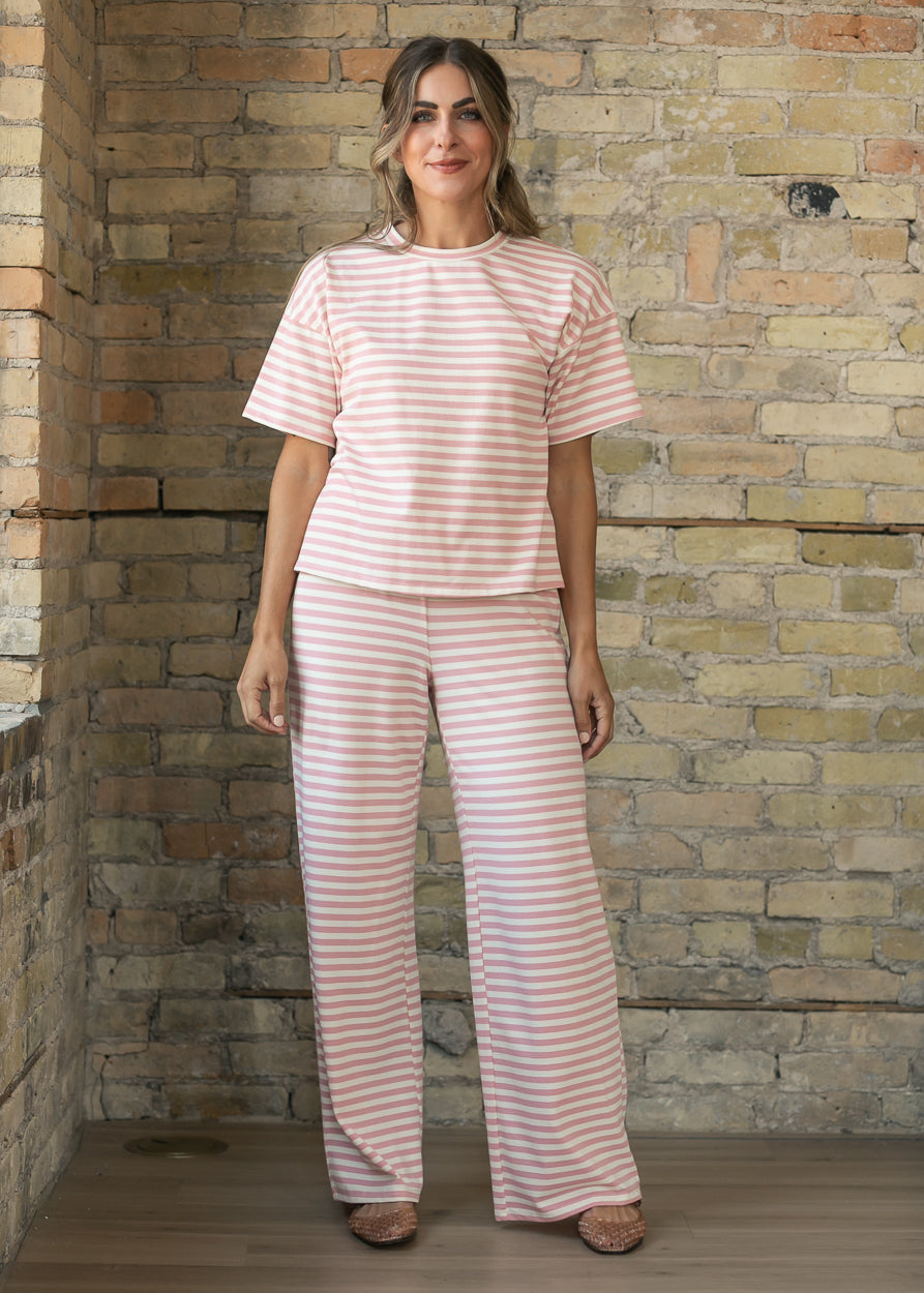 Pink striped short sleeve tee styled with matching wide-leg pants for a coordinated look.