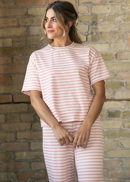 Pink and cream striped short sleeve tee with crew neckline and relaxed boxy fit.