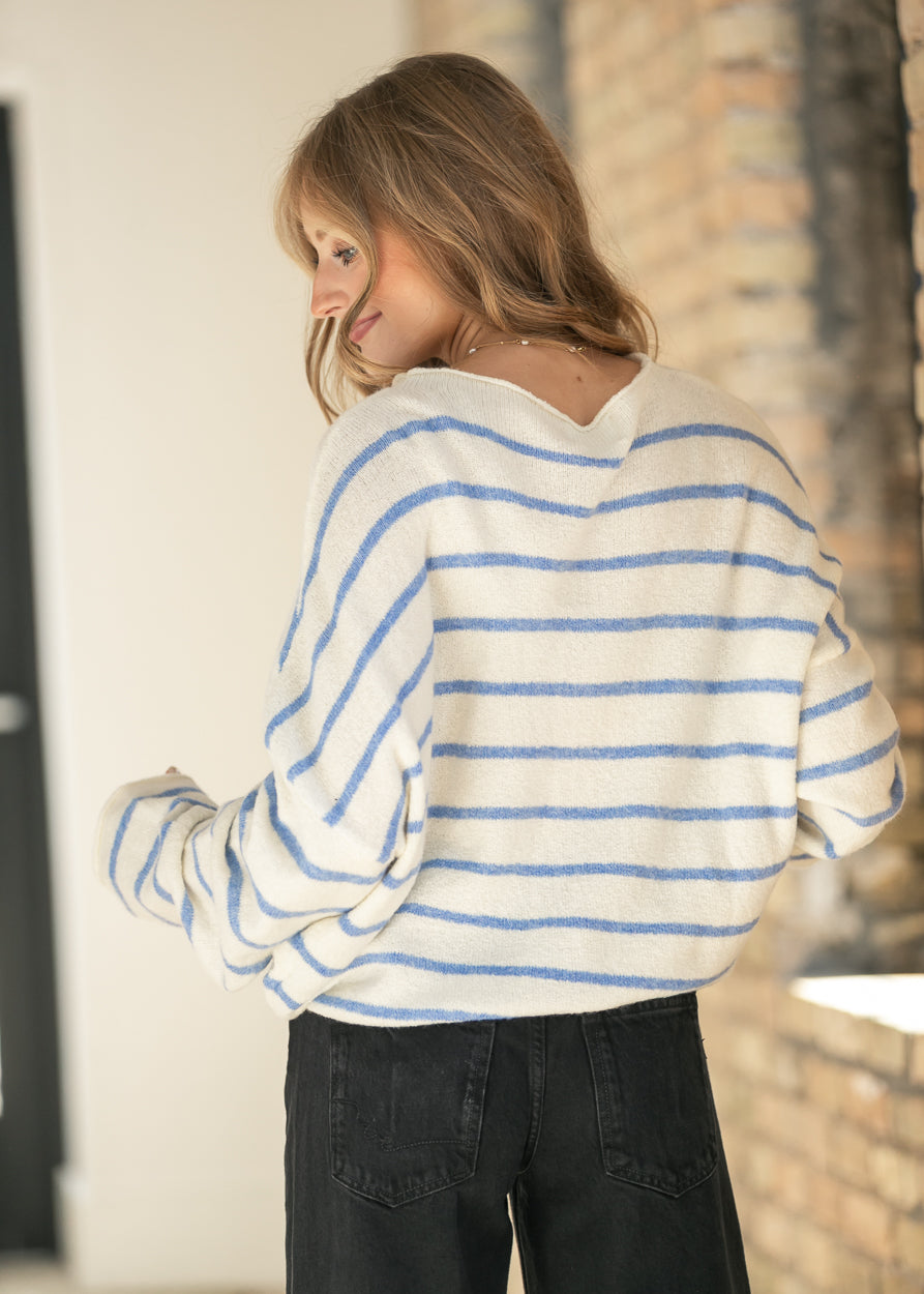 Back of the ivory and blue striped Piper cardigan showing its relaxed V-back neckline.