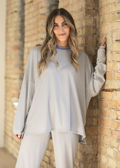 Things Between Kenzie striped top with dropped shoulders, contrast crew neckline, and relaxed oversized silhouette.