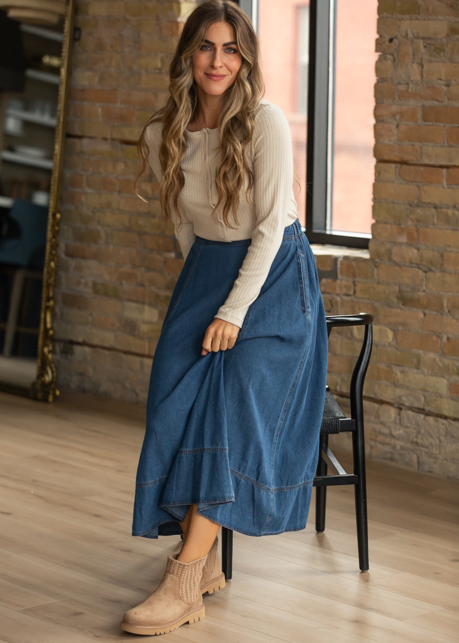 Thread & Supply Everly cardigan top tucked into a blue denim midi skirt