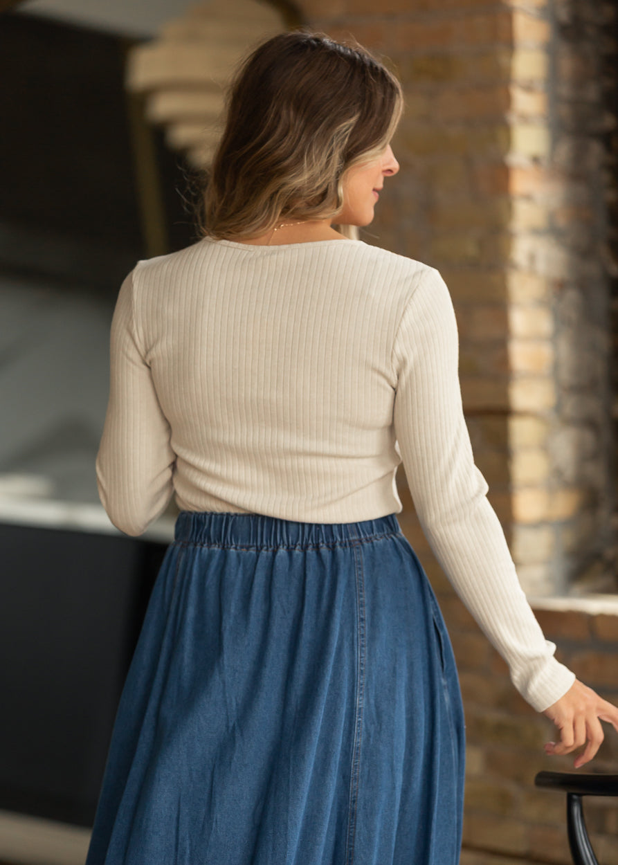Back view of oat cream fitted ribbed cardigan top with long sleeves