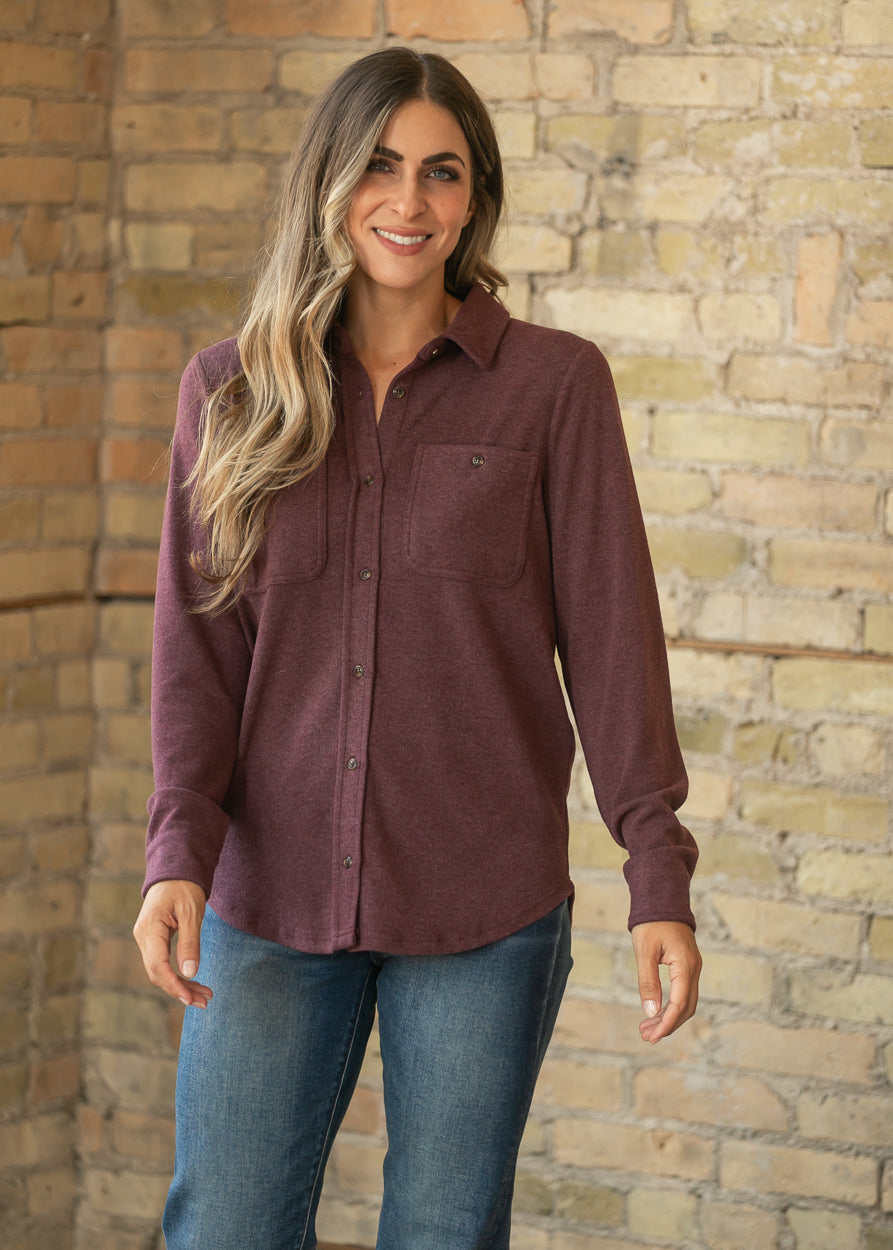 Burgundy Lewis long sleeve top with loose fit, button front, and chest pockets styled with denim.