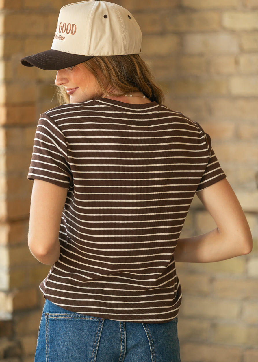 Back of mahogany striped short sleeve top showing the hip-length hem and rib-knit texture.