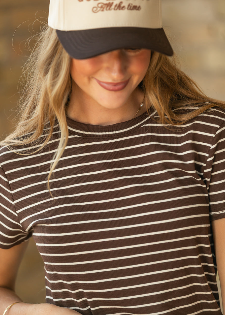 Close-up of mahogany and cream striped rib-knit top showing the crew neckline and short sleeves.