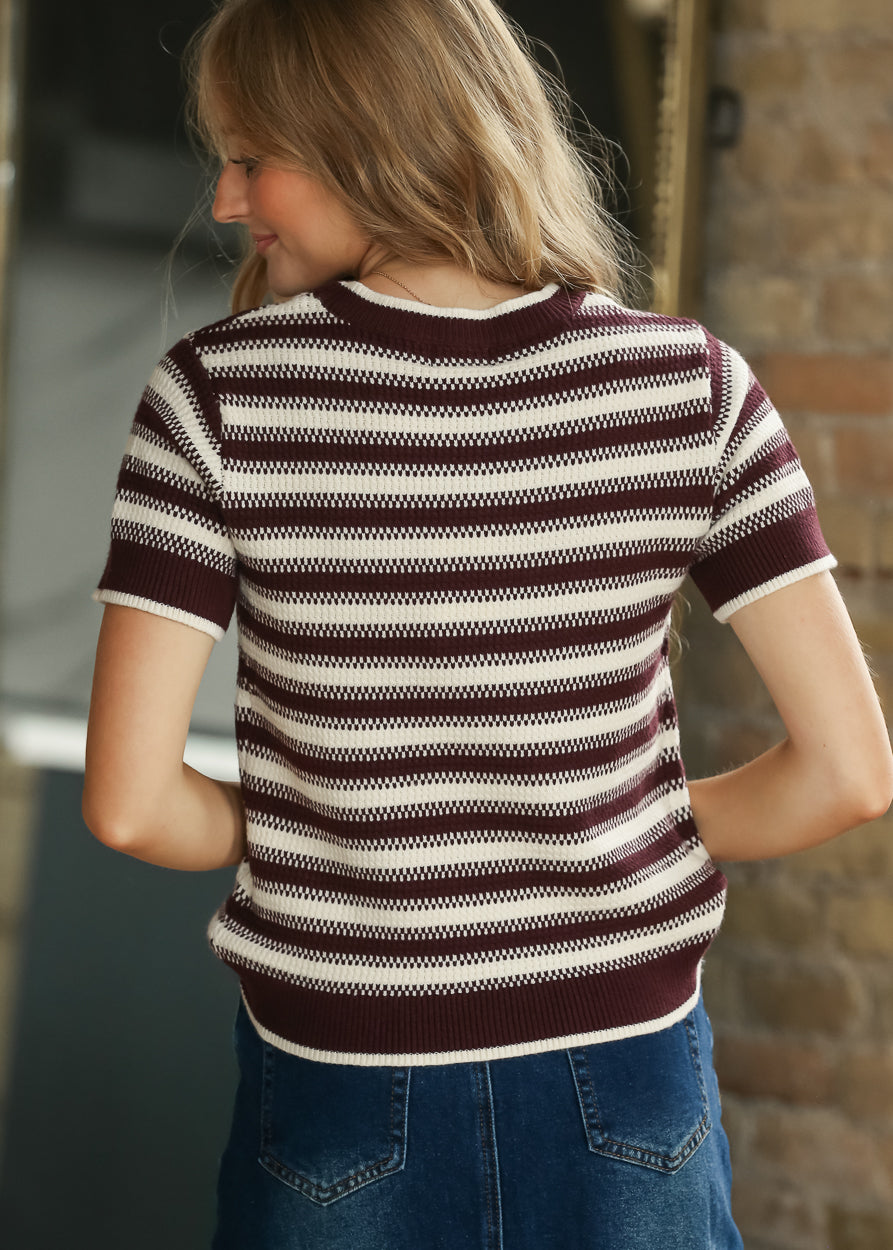Back view of maroon and cream striped Welles knit top with short sleeves and ribbed hem.