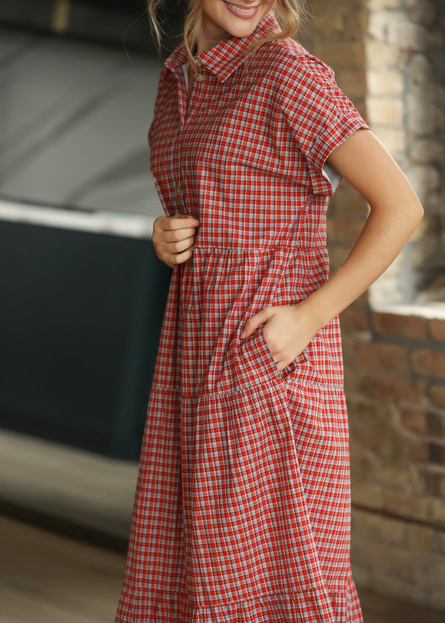 Red gingham button-front midi dress with collared neckline, short sleeves, and gathered waist seam.