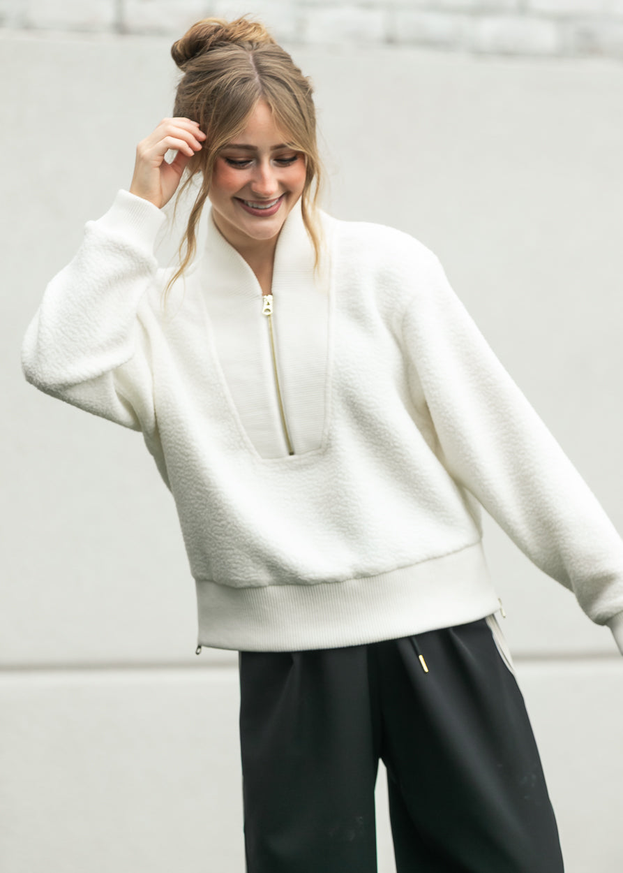 Cream Varley Mumford fleece with relaxed sleeves and half zip neckline