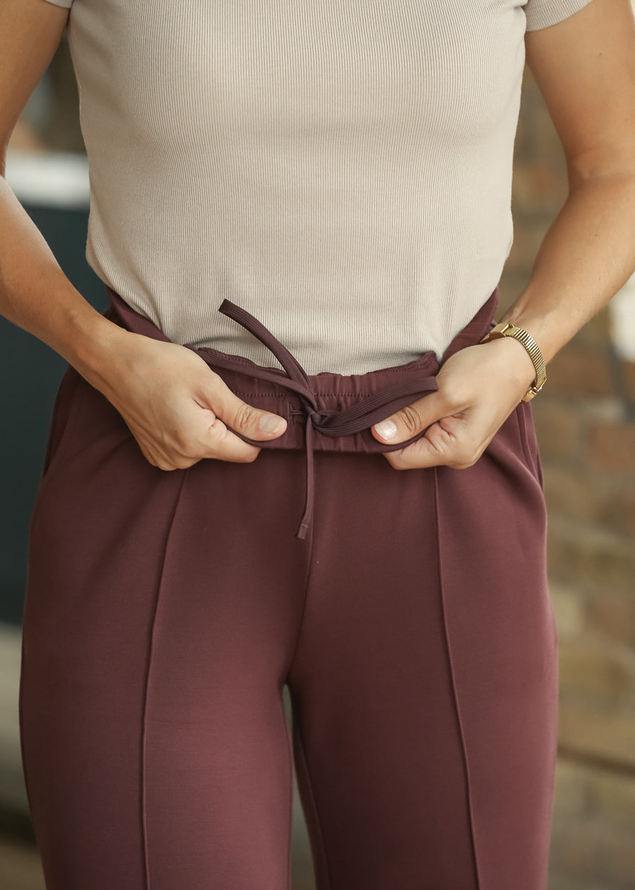 Varley Mahogany pants showing hidden interior drawstring at the waistband