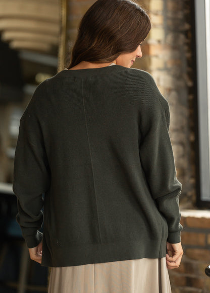 Back view of dark olive knit cardigan with loose fit and long sleeves