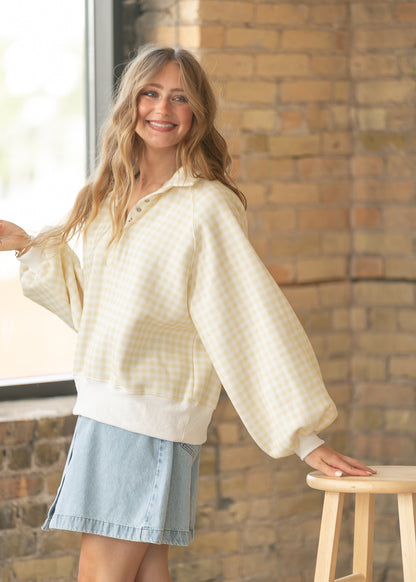 PaperMoon yellow gingham pullover paired with a denim skirt and white sneakers.