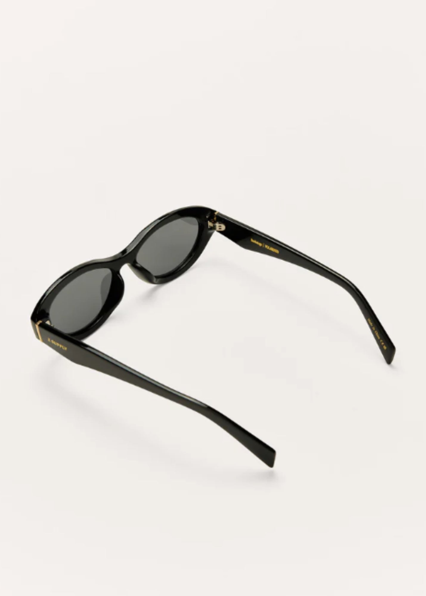 Angled view of black polarized sunglasses featuring sleek oval frames.