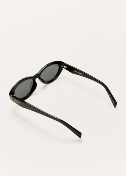 Angled view of black polarized sunglasses featuring sleek oval frames.