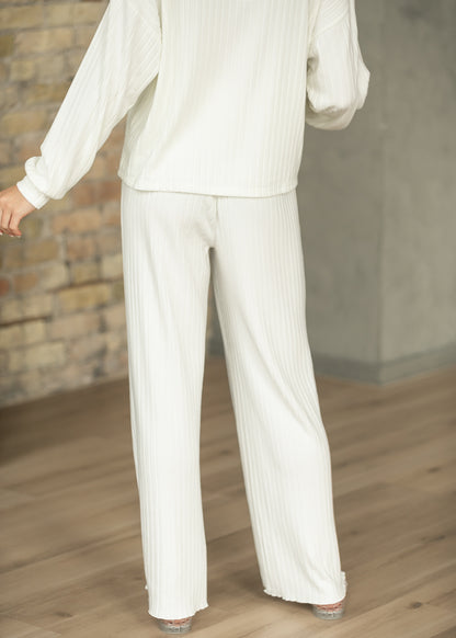 Bone white ribbed wide-leg pants shown from the front with matching long sleeve top.