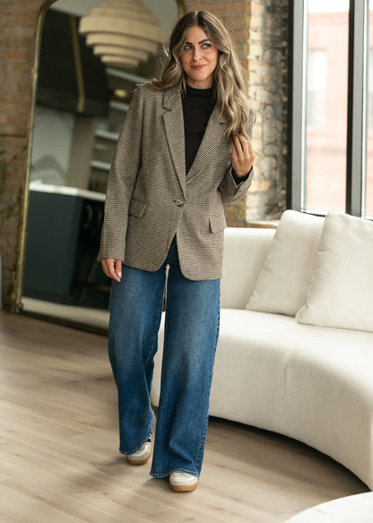 Z Supply Evan Check Blazer styled over a black turtleneck with medium wash denim.
