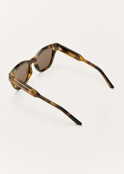 Back angled view of tortoise sunglasses showing slim temple design.