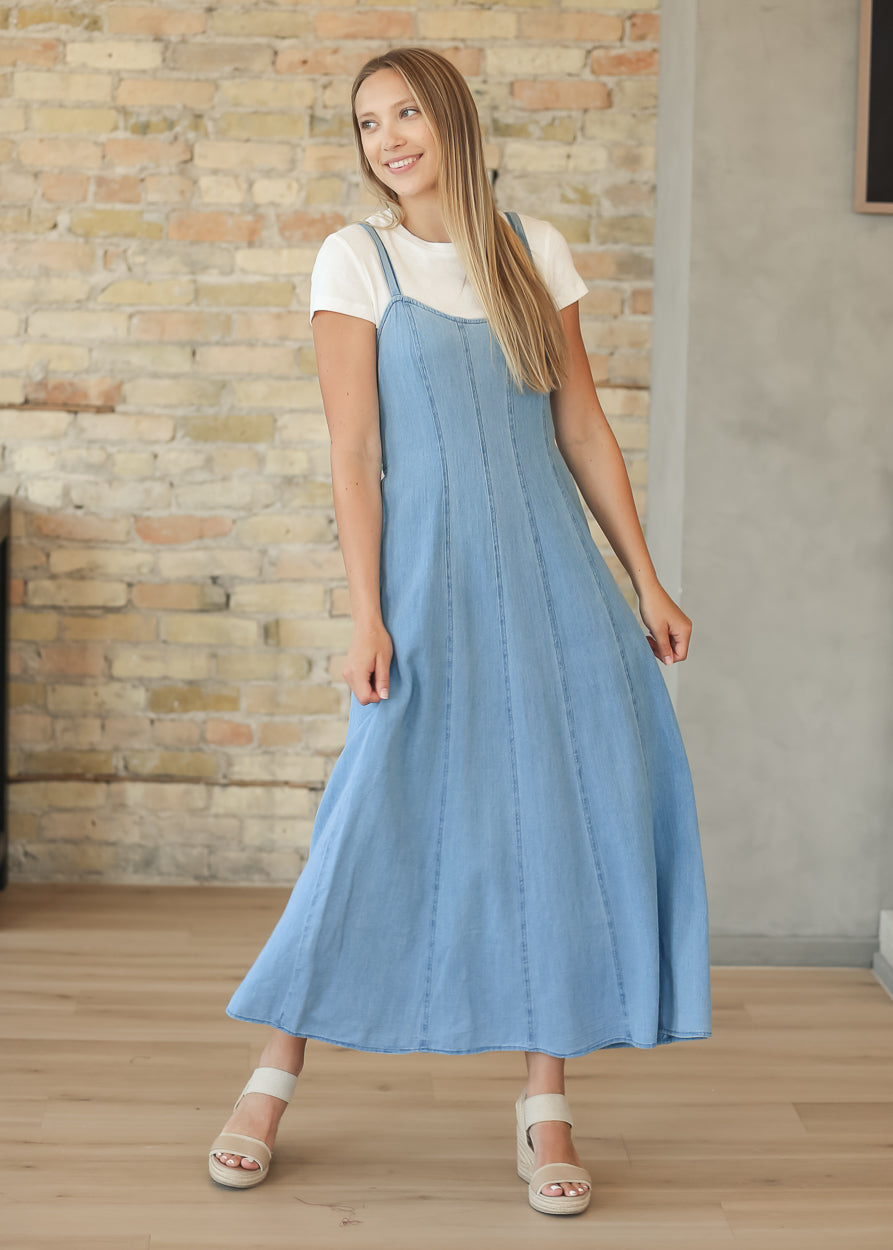 Flowing chambray midi dress with smocked back and comfortable everyday fit.