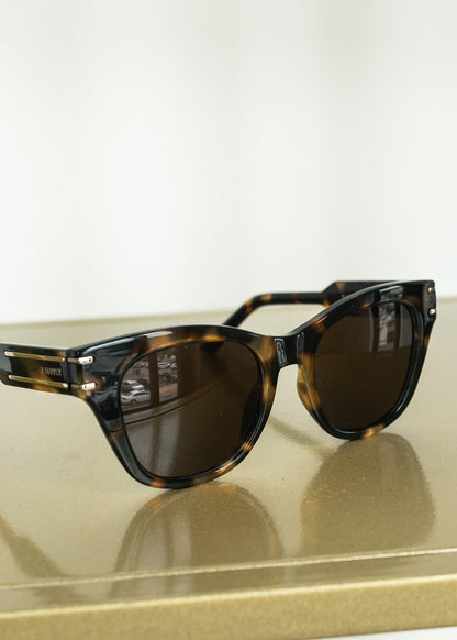 Close-up of Z Supply tortoise sunglasses featuring gold-tone temple detailing.