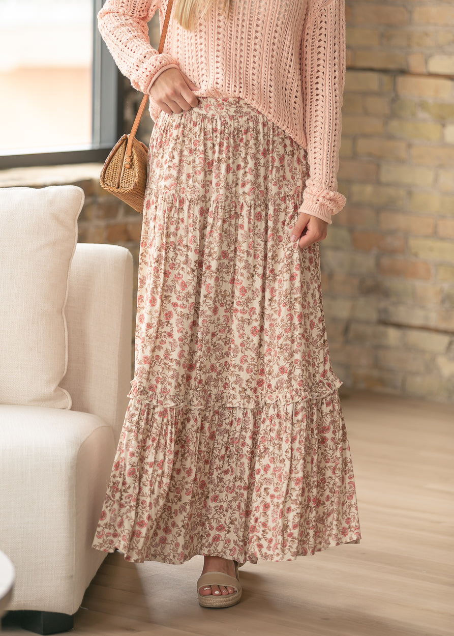 Front view of floral maxi skirt showing ruffle trim and flowing maxi-length silhouette.