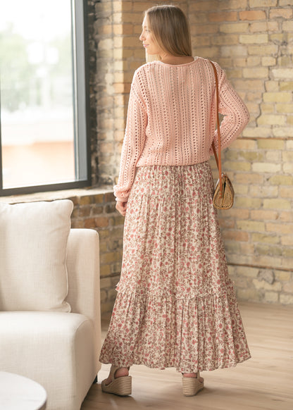 Back view of floral maxi skirt showing flowy silhouette and tiered ruffle accents.