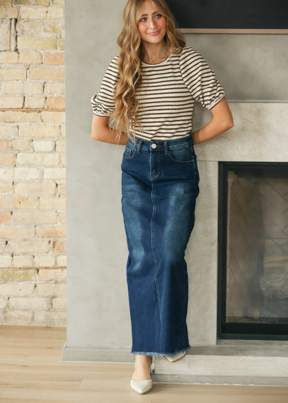 Brown and cream striped short sleeve tee styled with a dark wash denim maxi skirt and cream flats.