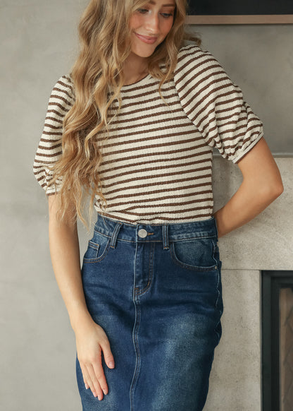 Brown striped tee tucked into a dark wash denim maxi skirt for an easy everyday outfit.