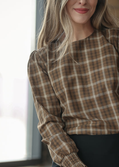 Brown plaid long sleeve top with square neckline and relaxed silhouette.