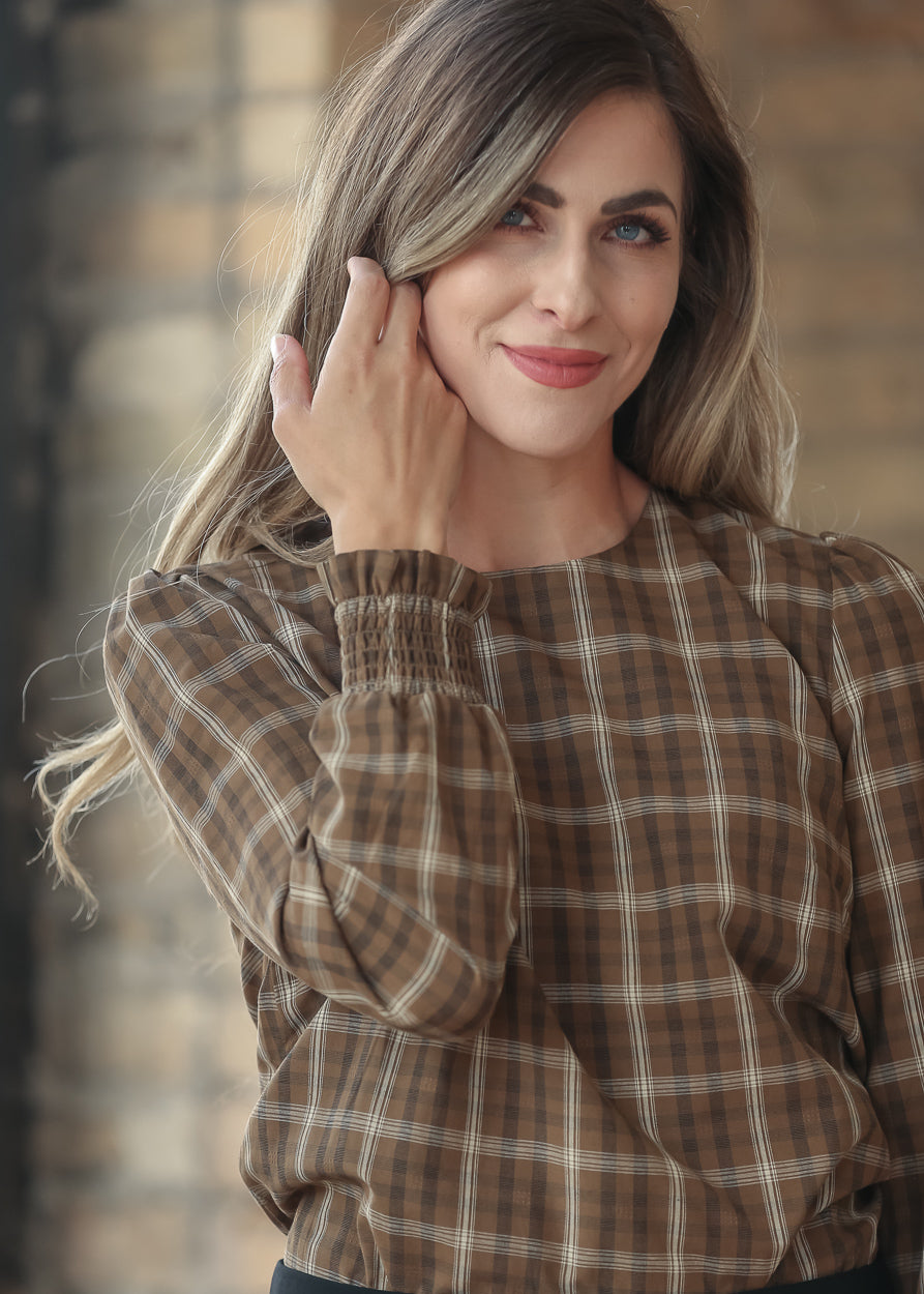 Close-up of Blake brown plaid top showing the square neckline and woven cotton pattern.